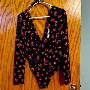 New with tags! Size small deep v body suite.